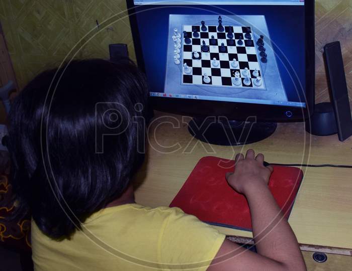 Asian Girl Playing Chess