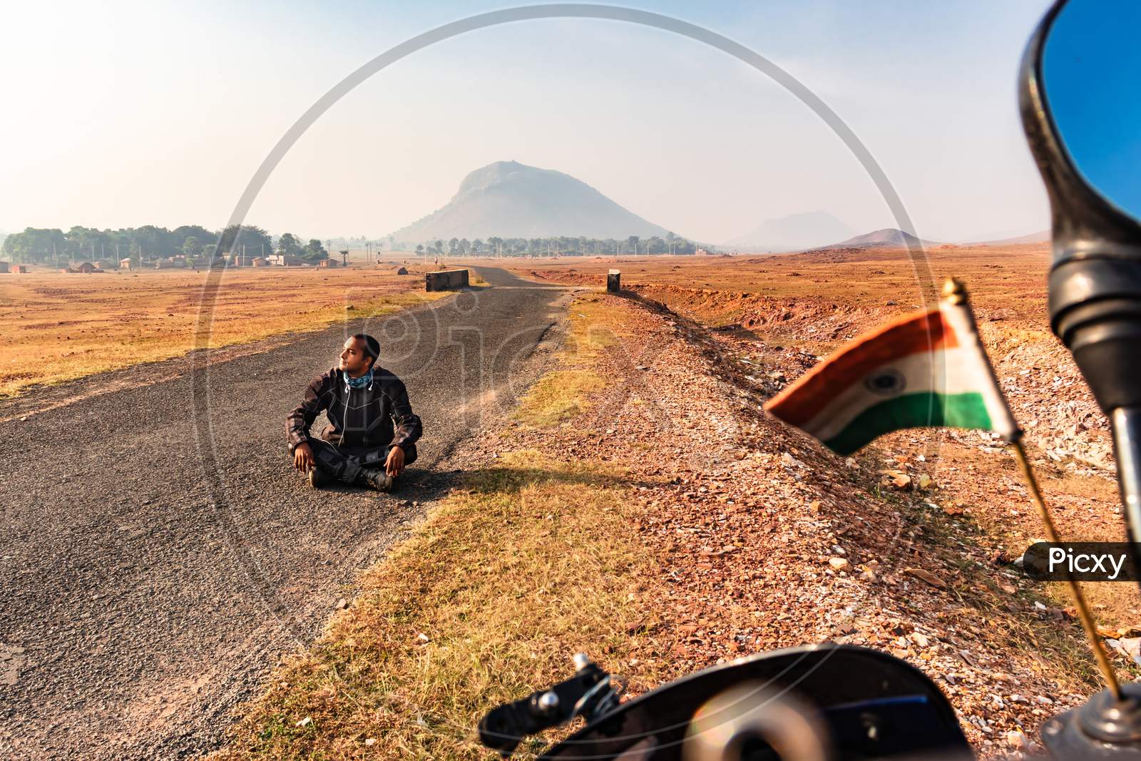 Motorcycle Rider Sitting On Tarmac Road Isolated