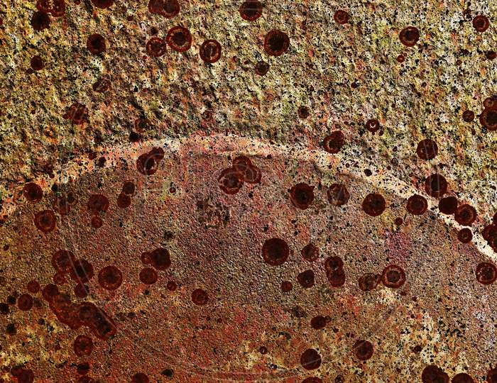 Rusty metal textures on aged and weathered walls in a detailed close up view
