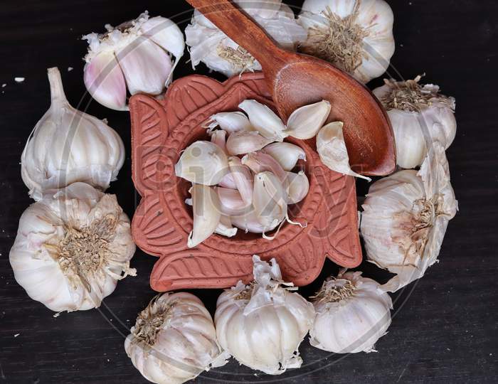 One whole aromatic white garlic isolated on white background