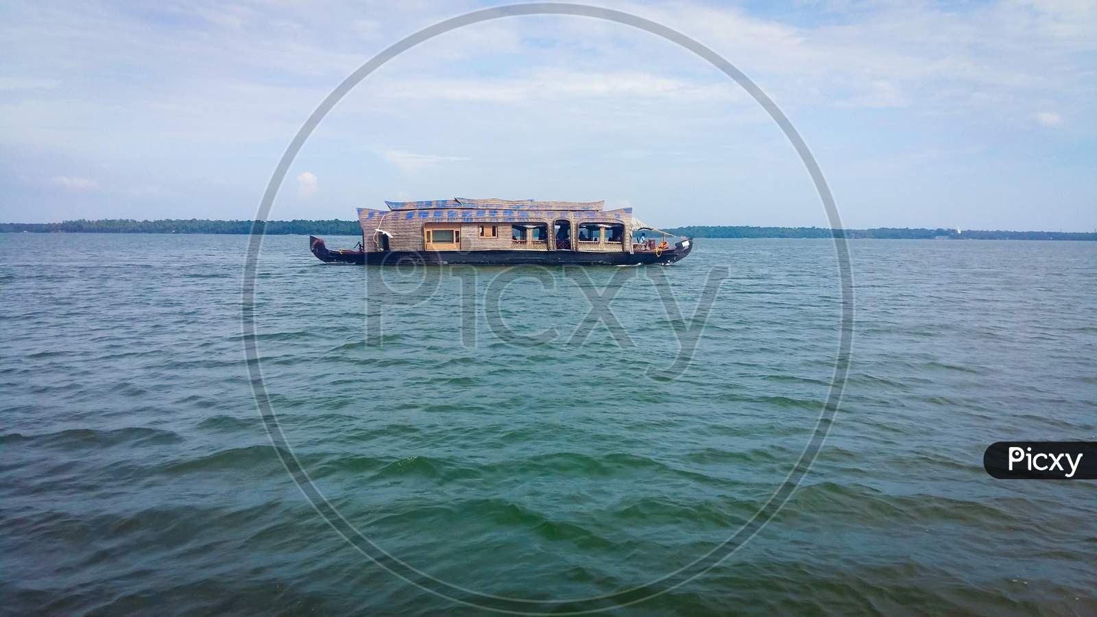 A Houseboat In A Lake At The Kerala Backwaters In India. Houseboat On Kerala Backwaters Ashtamudi Lake.