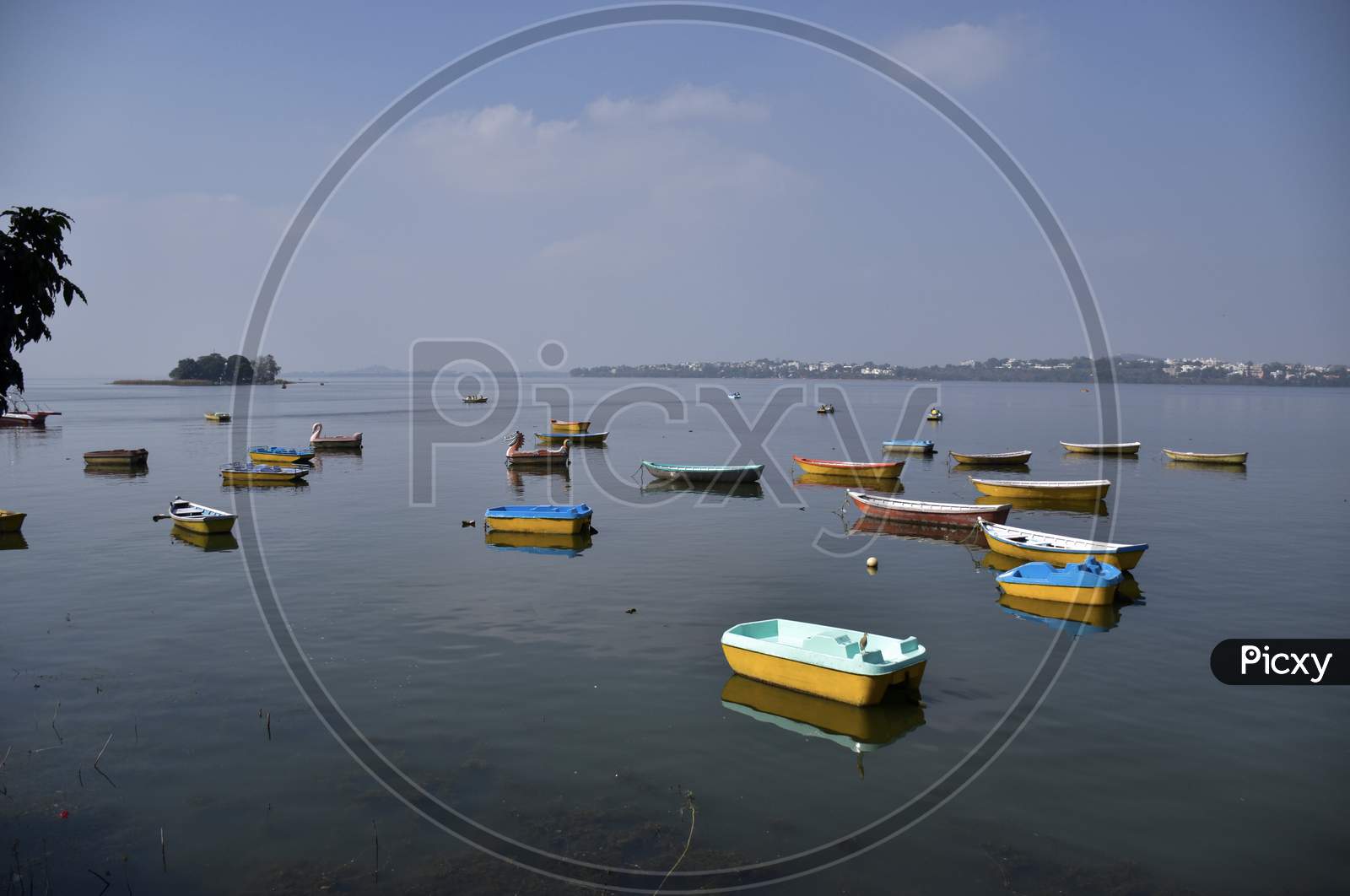 Small Multi color Boats Sailing In The Lake, Bhopal
