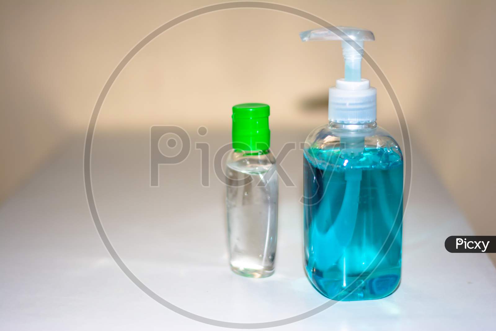 Blue bottles of hand sanitizer and anti-bacterial hand gel, Hand washing, Hand hygiene for Corona virus prevention