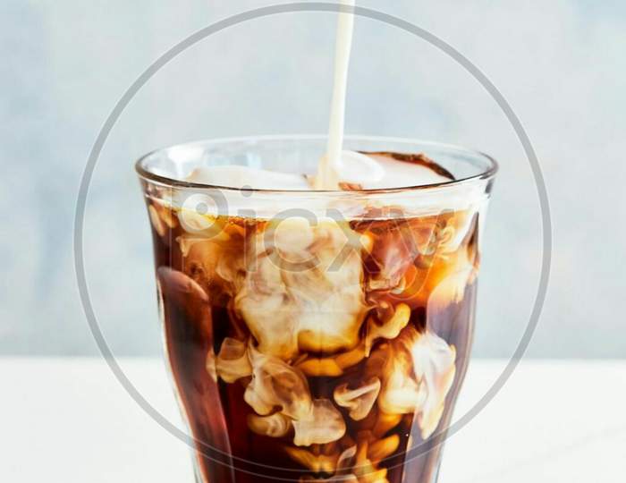 Glass with chocolate shake and straw