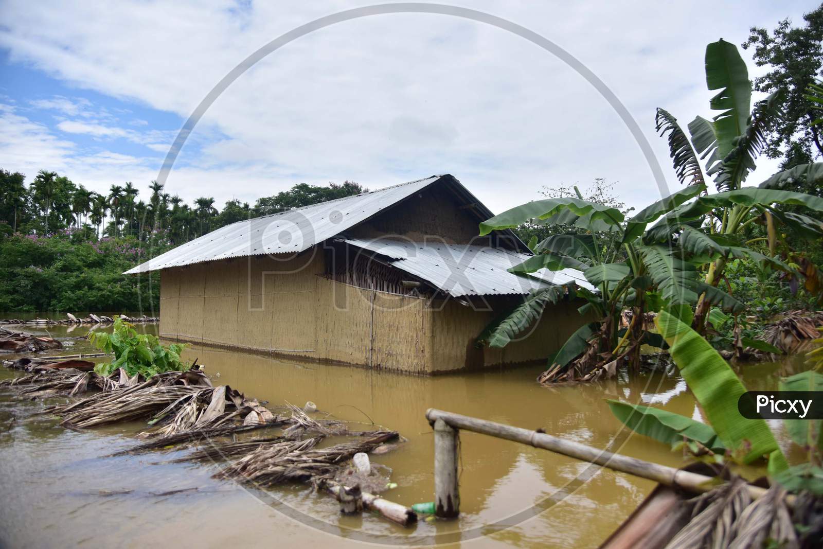 A Submerged Hut At Flood Affected Bakulguri Village Near Kampur In Nagaon District Of Assam On May 27,2020.