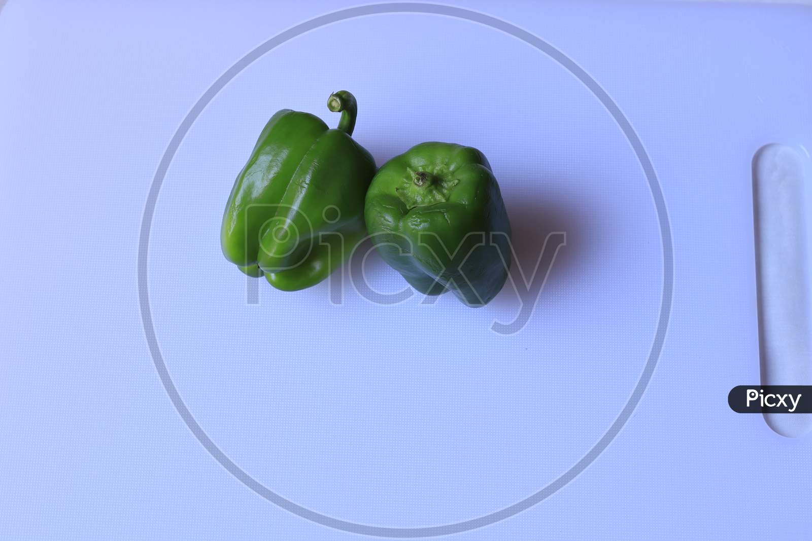Organic Green bell pepper isolated on white background