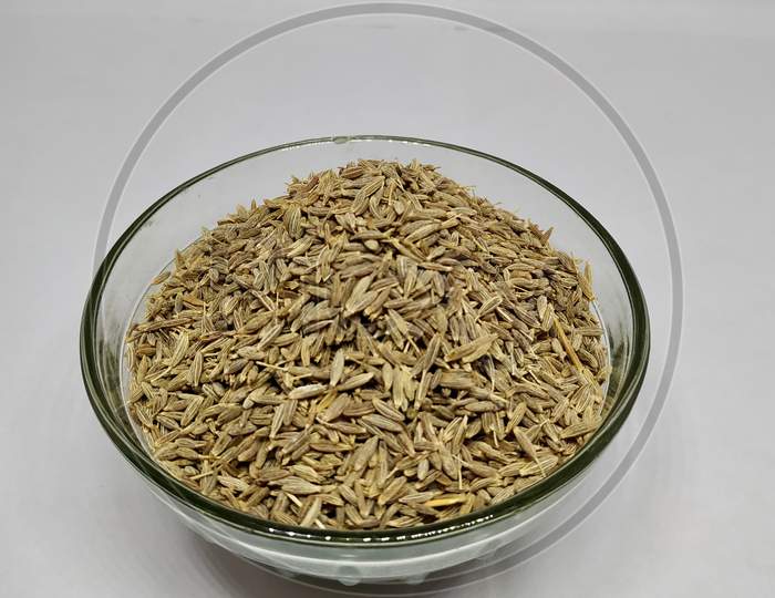 Common Cumin Or Zeera In A Glass Bowl On White Background Stock Photo