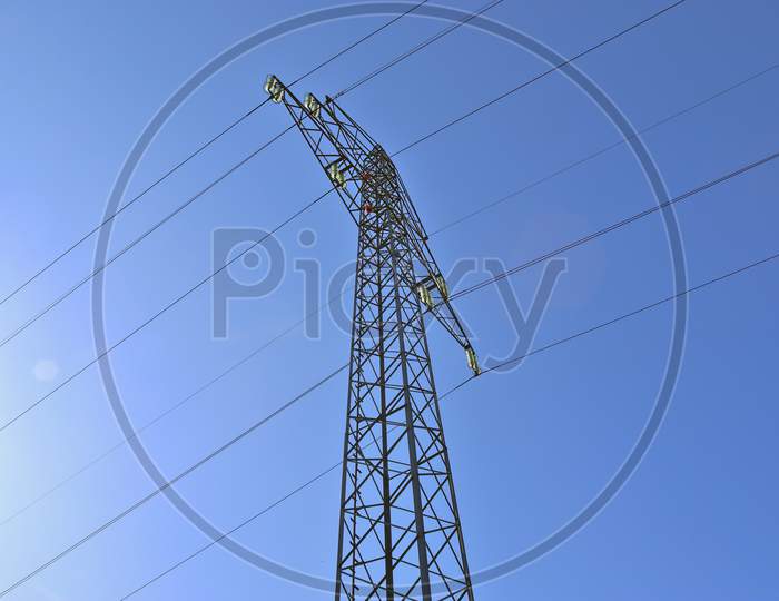 Big power pylon transporting electricity in a countryside area