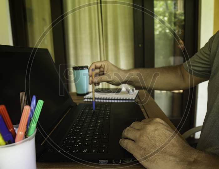 Man Doing Computer Work From Home During Quarantine. Social Isolation Of Office Workers Teleworking During The Pandemic