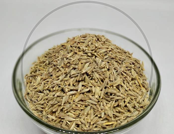 Cumin Or Zeera In A Glass Bowl On White Background Stock Photo