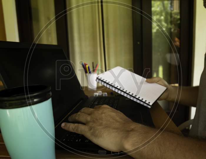Man Doing Computer Work From Home During Quarantine. Social Isolation Of Office Workers Teleworking During The Pandemic