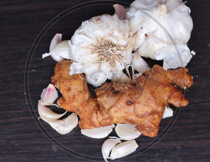fresh ginger and garlic isolated on black background