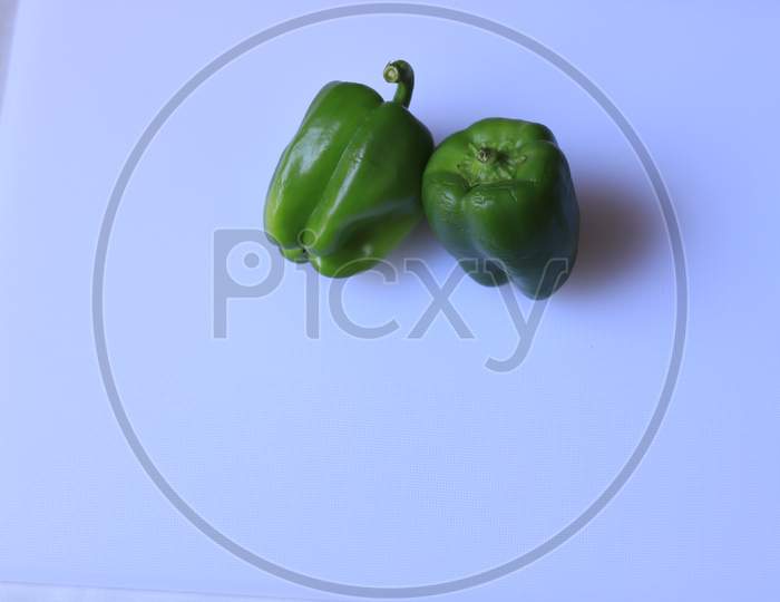 Organic Green bell pepper isolated on white background