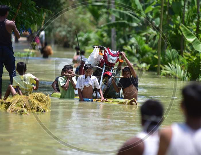 Villagers  Transported A Bike On A Raft Made From Banana Trees  Towards A Safer Place At Doboka  In  Hojai  District Of Assam  On May 28,2020.