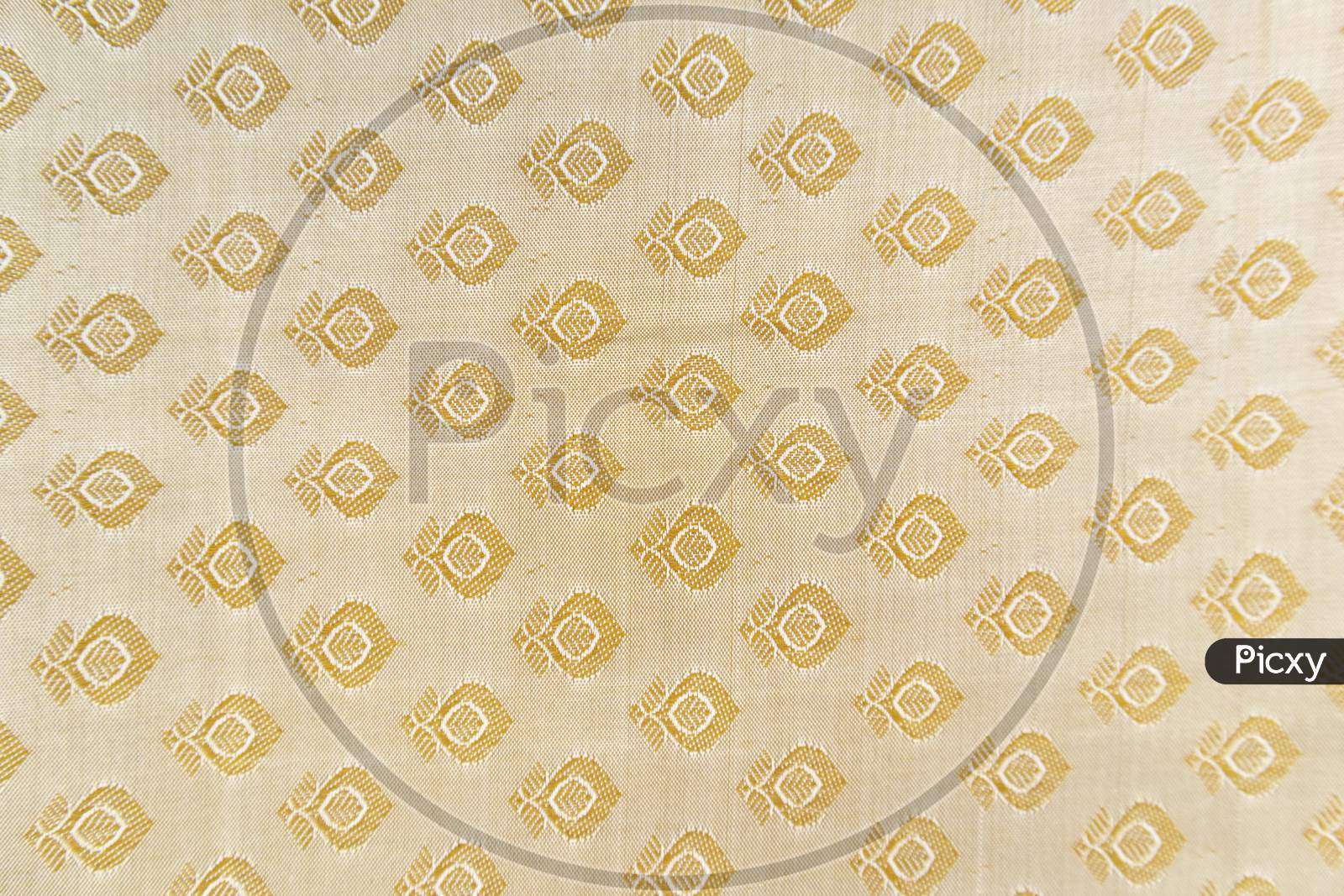 Maski, India - October ,6 2019 - Traditional Indian Silk Saree Border Pattern With Golden Bright Colors And Floral Design.