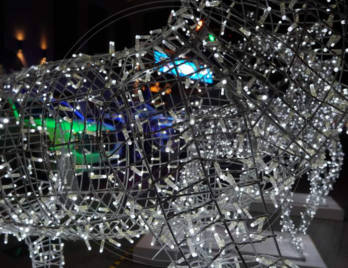 Close Up Of Glowing Reindeer Made Of Wire And Light Bulbs. Christmas Decorations. Lights On Reindeer Shape Wire Frame Mesh. Deer Outdoor Decoration. Decorative Lights- Dubai Uae December 2019