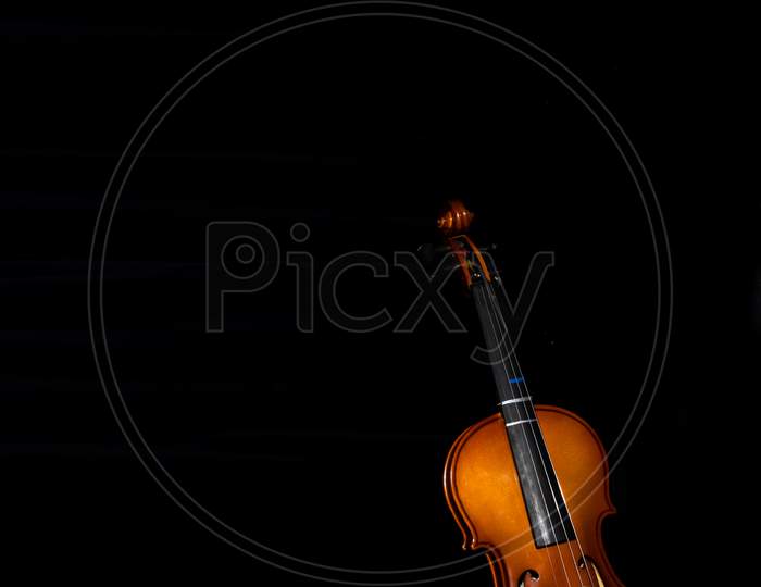 Violin Against A Black Background