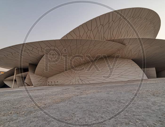 National Museum of Qatar (Desert rose) exterior  daylight view with clouds in sky