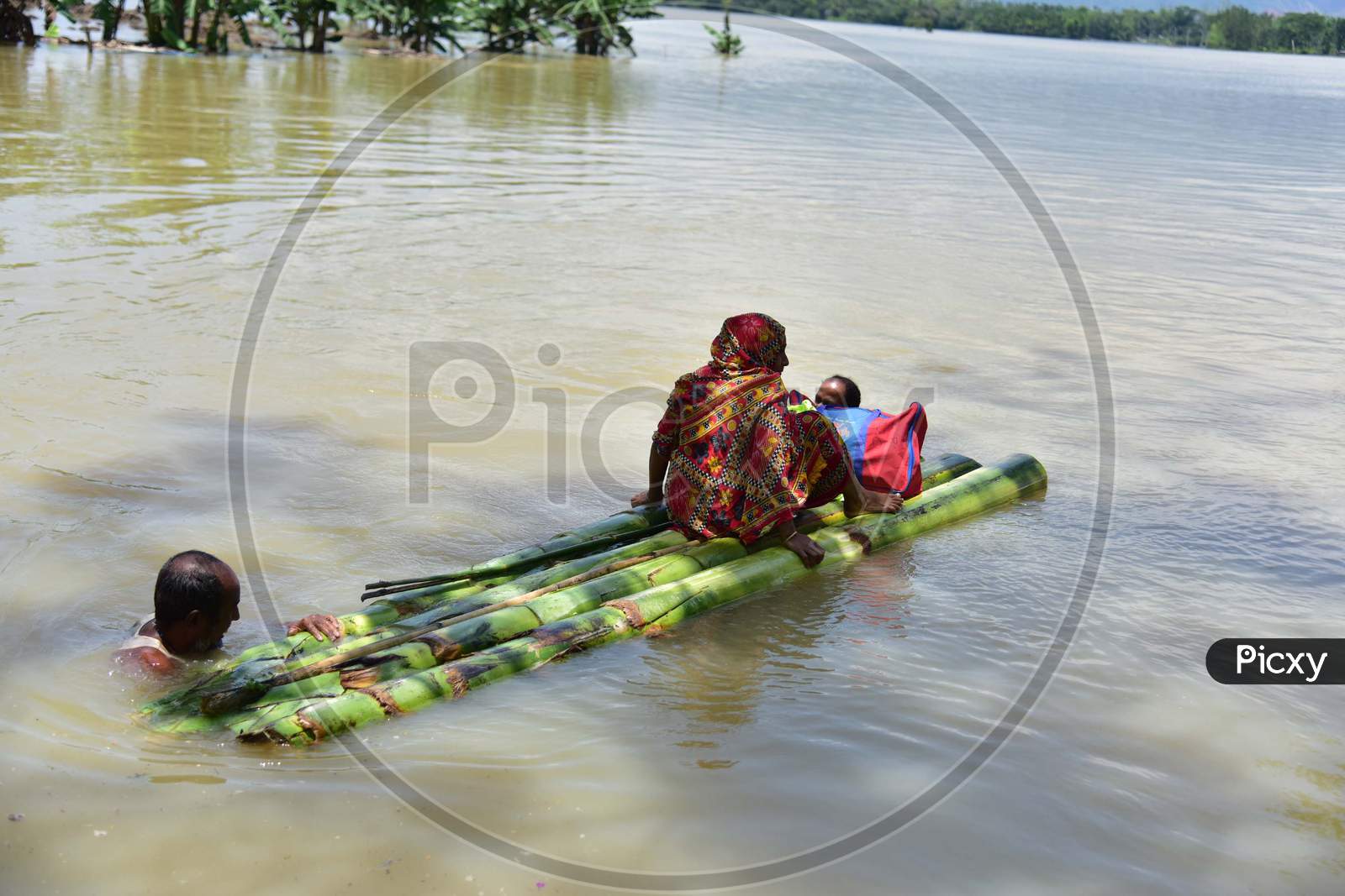 Villagers Using A Makeshift Raft  To Reach A Safer Place At Doboka  In  Hojai  District Of Assam  On May 28,2020.