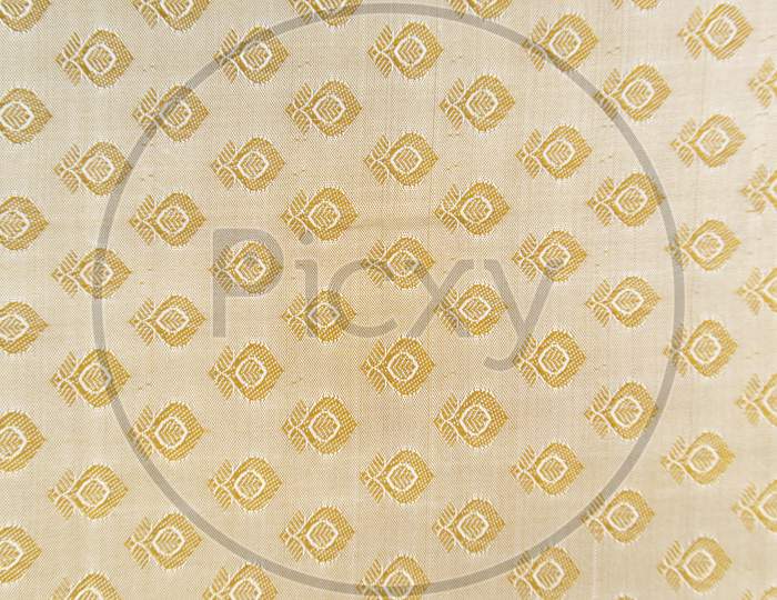 Maski, India - October ,6 2019 - Traditional Indian Silk Saree Border Pattern With Golden Bright Colors And Floral Design.