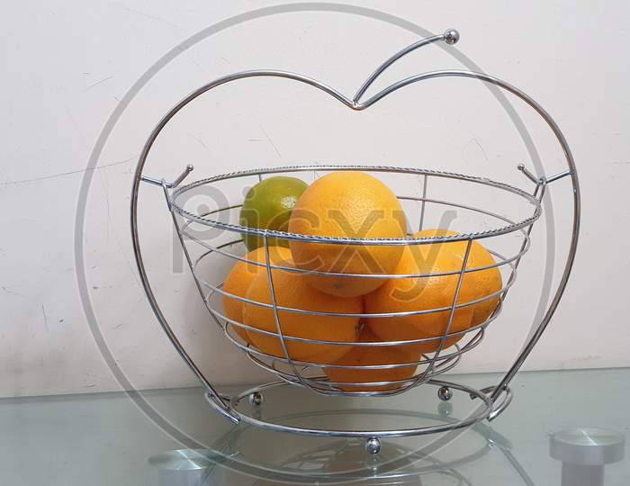 Orange in Steel basket in white background , Citrus Orenge