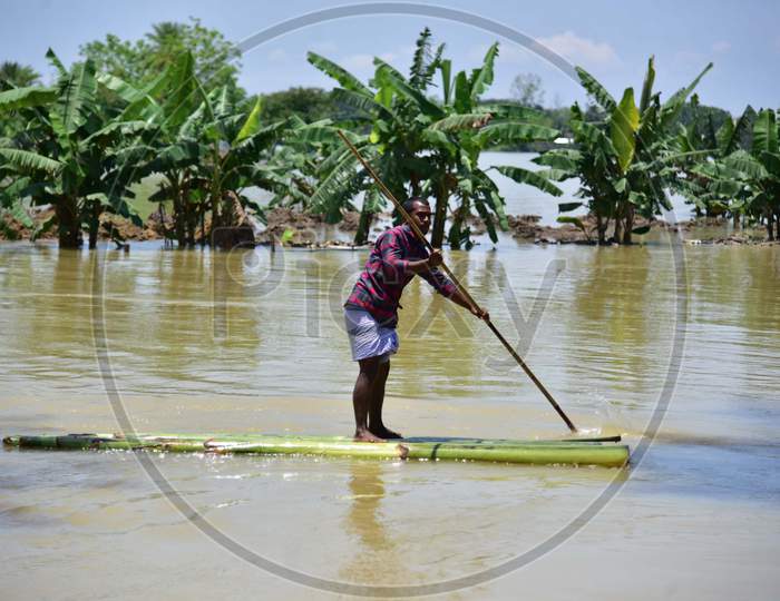 A Man Row A Makeshift Banana Raft At Flood Affected  Doboka  In  Hojai  District Of Assam  On May 28,2020.