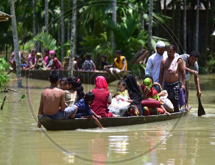Villagers Are Transported On A Boat Towards A Safer Place At Doboka  In  Hojai  District Of Assam  On May 28,2020.