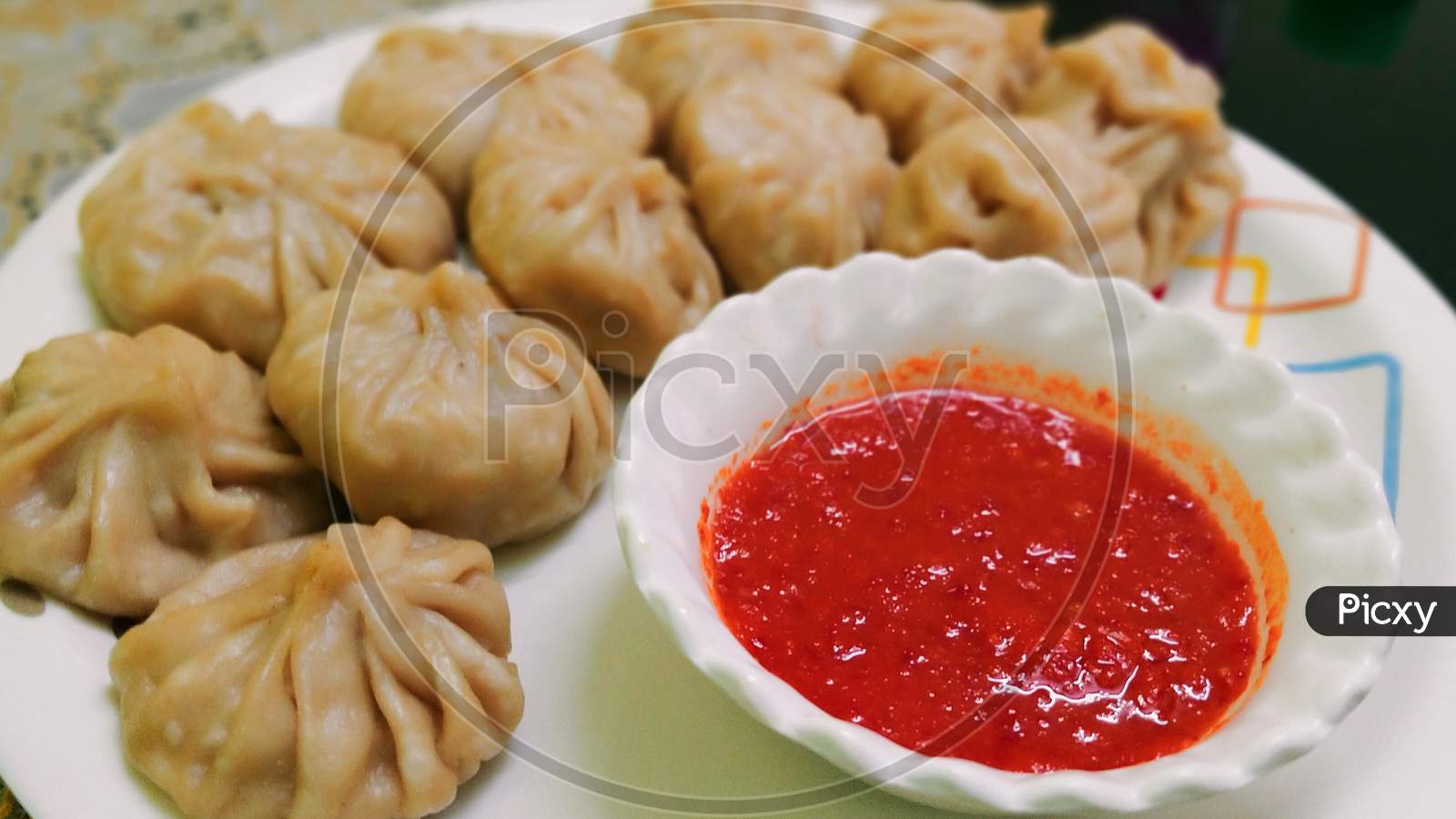 Momos with Red hot Sauce