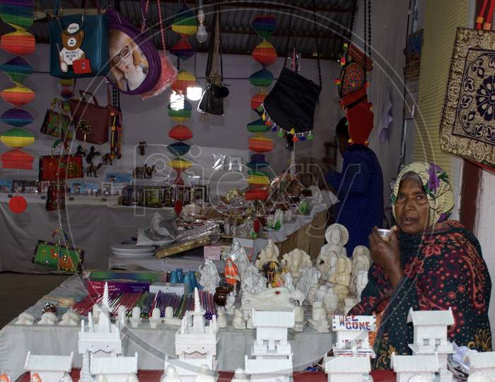 Jabalpur, Madhya Pradesh/India : January 29, 2020 - A Woman Having A Sip Of Tea And Selling The Marble Statues And Handbags At The Bhedaghat Market, Bhedaghat (Jabalpur)