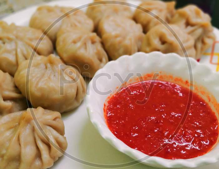 Momos with Red hot Sauce