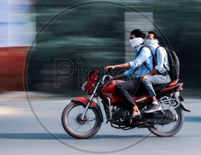 panning shot of  two boys rushing for their college