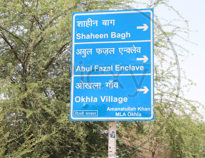 "New Delhi /India-27/05/2020 : Sign Board In Green Showing Distance Of Towns  Shaheen Bagh ,Abul Fazal Enclave And Okhla Village  Texture In White "