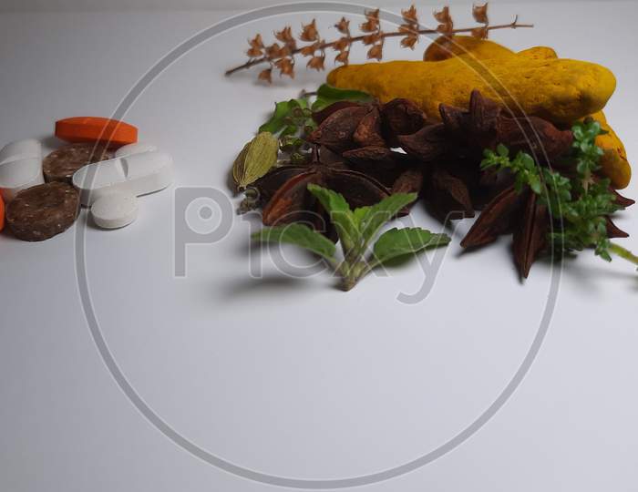 Herbal Medicine Vs Brown Chemical Pills Isolated Medicine The Alternative Healthy Car .Leaf ,Medical On White Background