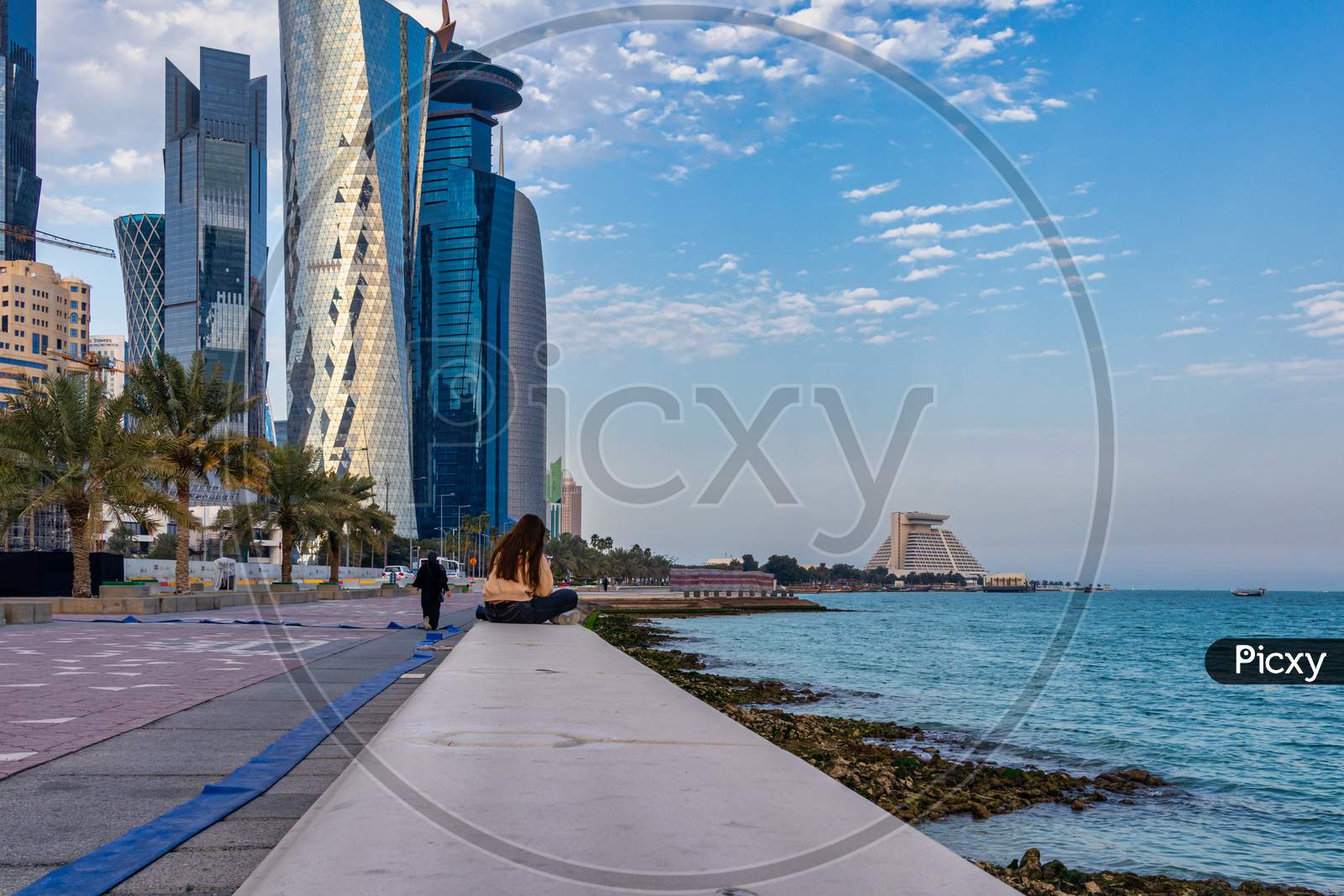 Doha cor niche Daylight view with skylines and clouds in sky in background