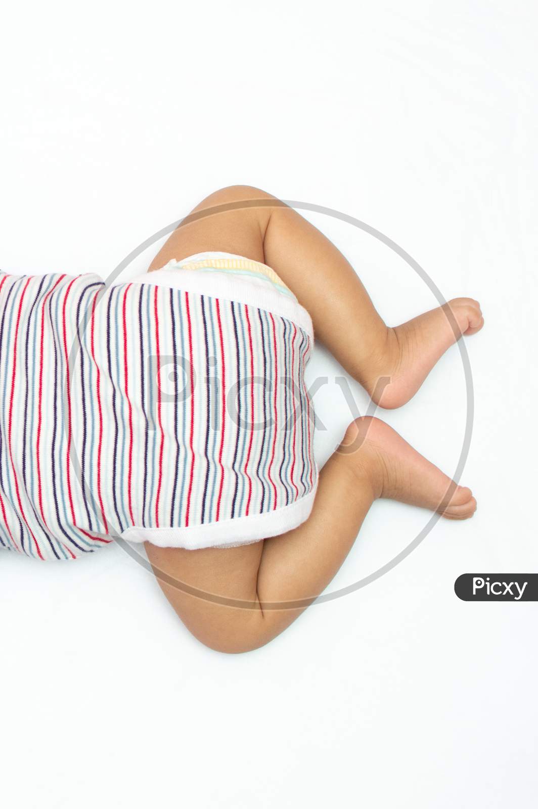 Infant Legs Over Head Photo Lying On His Chest