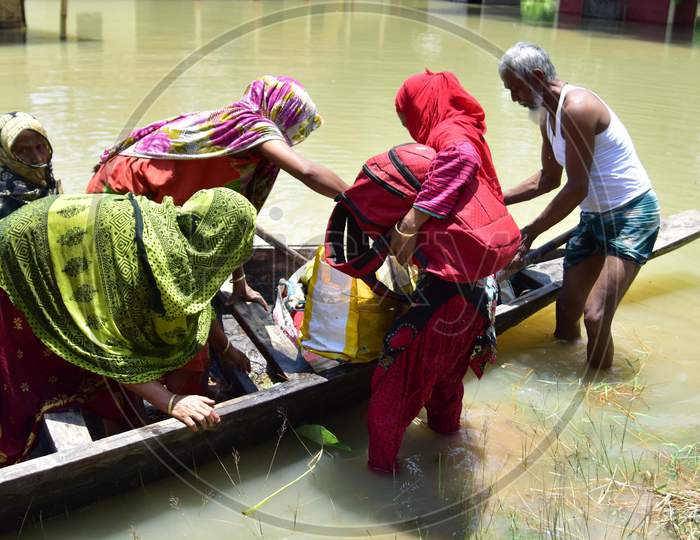 Villagers Are Transported On A Boat Towards A Safer Place At Doboka  In  Hojai  District Of Assam  On May 28,2020