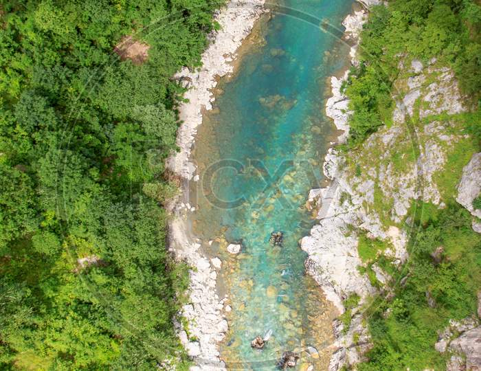 Drone view of turquoise Tapa River and forest