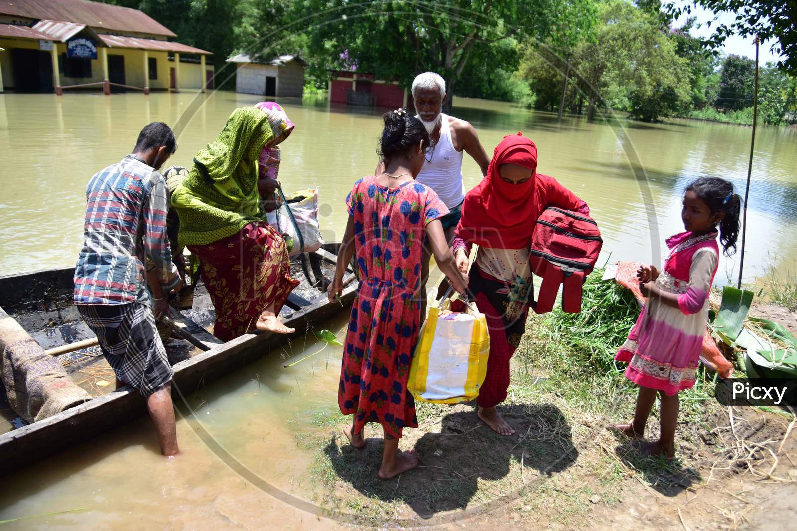 Villagers Are Transported On A Boat Towards A Safer Place At Doboka  In  Hojai District Of Assam  On May 28,2020.