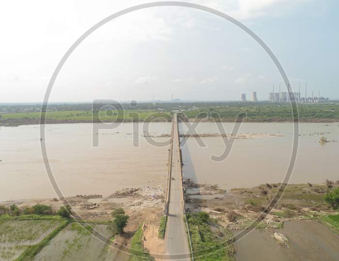 Aerial View Of Bridge Above The Krishna River Near Raichur Thermal Coal Power Plant, India.