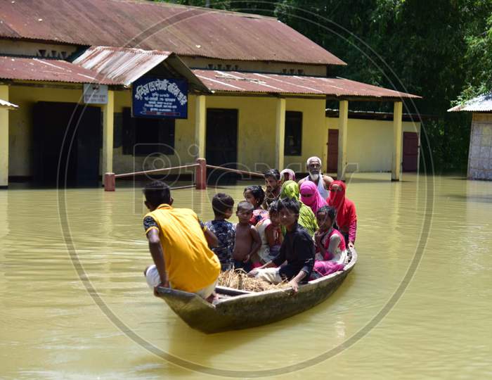 Villagers Are Transported On A Boat Towards A Safer Place At Doboka  In  Hojai  District Of Assam  On May 28,2020.
