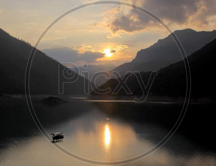 Piva Lake At Sunset In The Mountains Of Montenegro