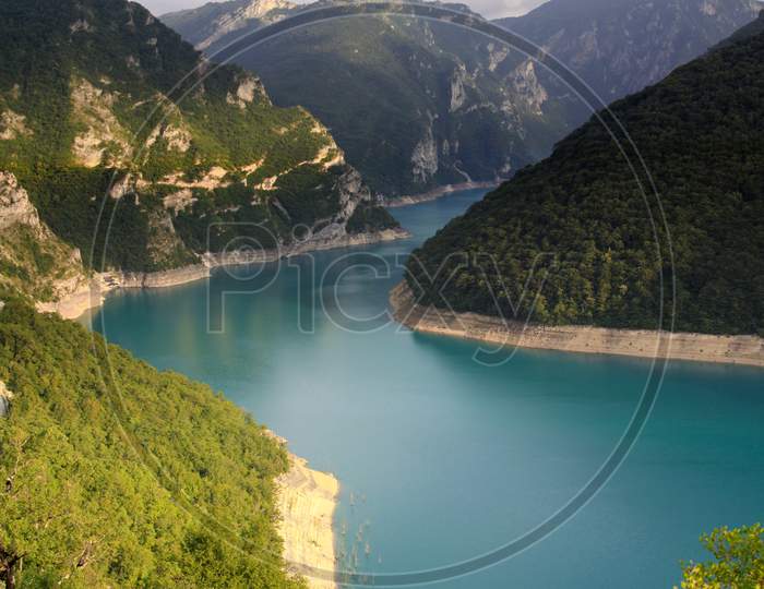 Piva Lake Reservoir In The Mountains In Montenegro