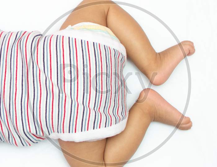 Infant Legs Over Head Photo Lying On His Chest