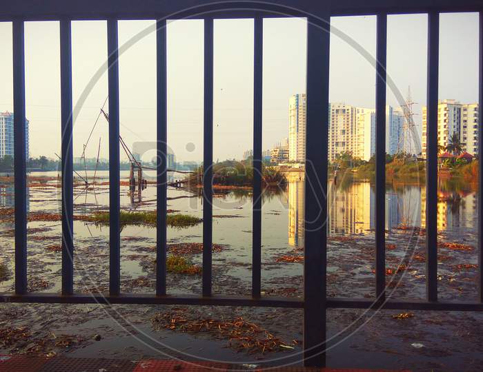 A wide angle view through steel fence