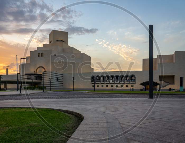 Museum of Islamic Art , Doha,Qatar  exterior view at sunset with clouds in the sky in the background