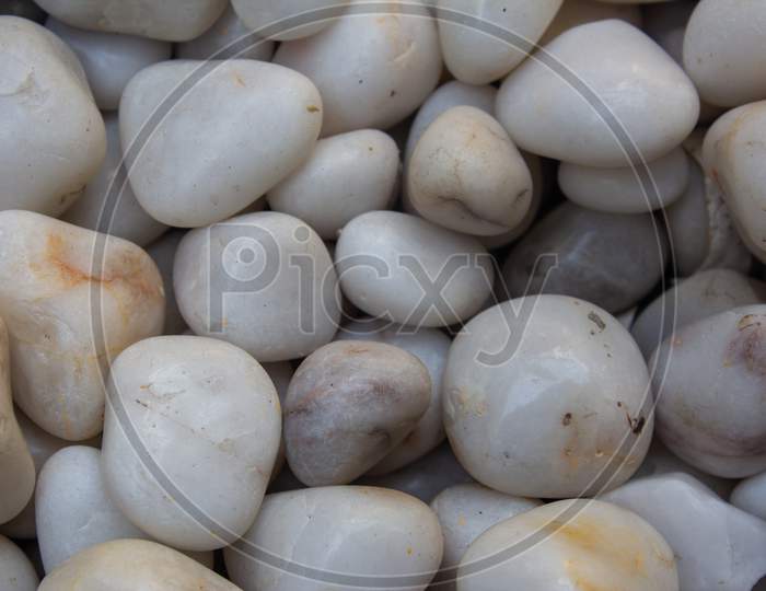 White And Gray Stones Used For Decoration Purpose. Smooth Pebble Stones Used In Water Fountains