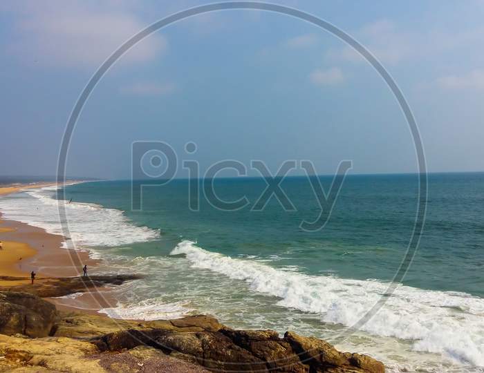 Landscape Image Of Azhimala Beach In Trivandrum, India. Arabian Sea And Rocky Shores.