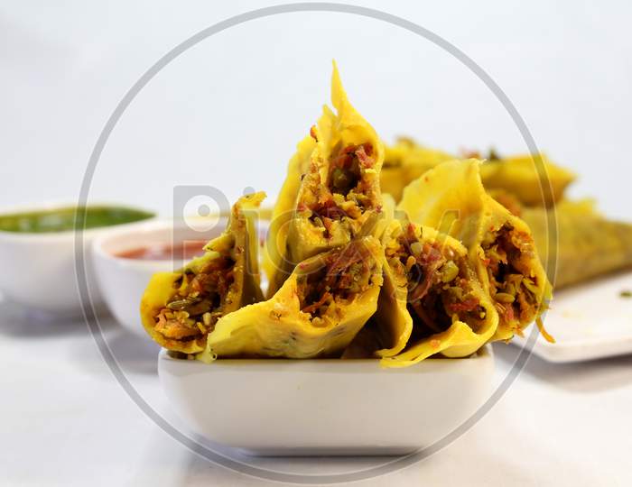 Muthiya is traditional Gujarati steam cooked food made from corn,fenugreek, carrot, besan and wheat flour and served with oil and chutney.healthy food