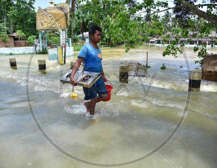 A Man  Carrying His Belongings Shifts To A Safer Place During Floods At Kampur  In Nagaon District Of Assam On , May 29, 2020.