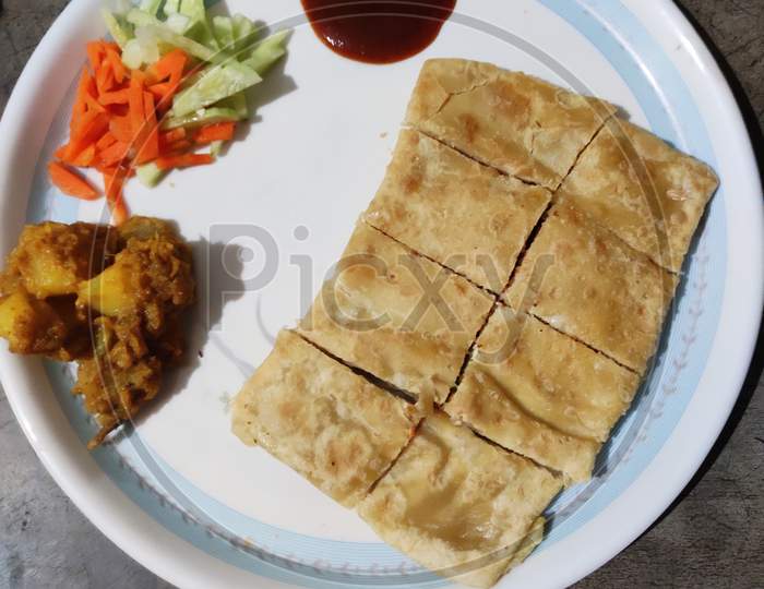 Moglai Parota and sauce in the plate.